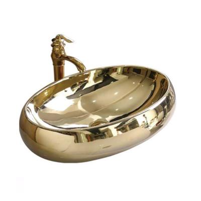 China Luxury Ceramic Sanitary Ware Scratch Proof Sink Gold Face Oval Face Hand Bathroom Sink Counter Top Sanitary Sink for sale