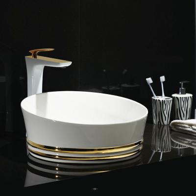 China Easy Clean Luxury Ceramic Sanitary Ware Hotel Hand Basin Countertop Golden Bathroom Decorative Round Gold Sink for sale