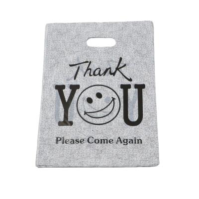 China Packaging Die Cut Disposable Cheap Shopping Handle T-Shirt Thank You Plastic Bag for sale