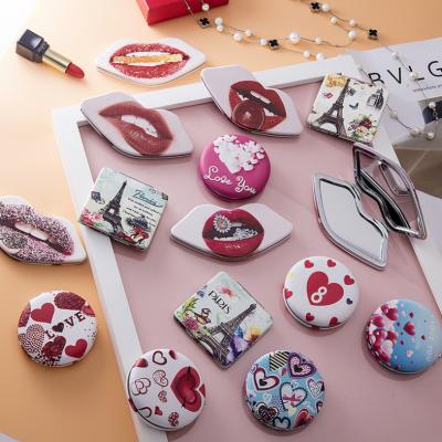 China Custom Portable Folding Makeup Mirror Round Shape Gift Pocket Beauty Contract Enlarging Leather Hand Mirror for sale