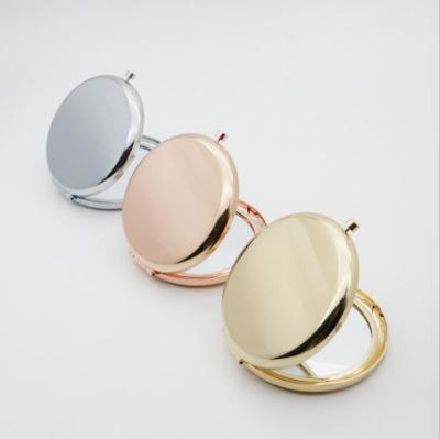 China Portable Solid Color Magnifying Makeup Mirror Compact Metal Round Case Pocket Mirror Double Side Rose Gold Automatic Beauty Accessories for sale