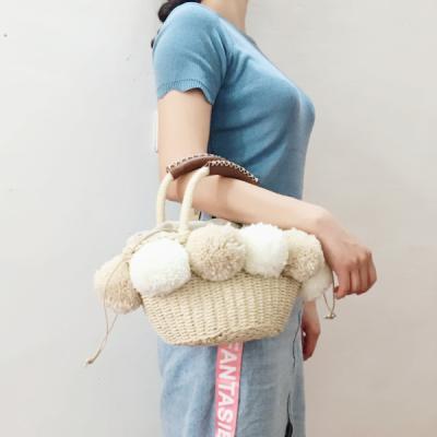 China 2021 New Style Joker Style Hot Sale Fashion Ladies Handbag The Bulb Straw Basket Shoulder Straw Bag Decorative for sale