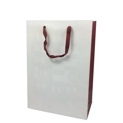 China Matt Lamination Luxury Folding White Recyclable Paper Bag For Clothes Packing With LOGO Printed for sale