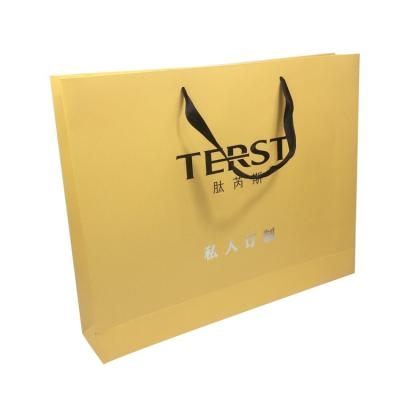 China BIODEGRADABLE Large Size Biodegradable Shopping Paper Bag With Silver Stamping LOGO For Clothing Packaging for sale