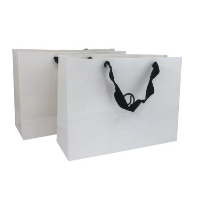 China Disposable Custom Design Gloss Lamination Clothing Gift White Luxury Paper Shopping Bag With Your Own LOGO for sale