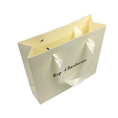 China Wholesale Disposable Stain UV Logo Shopping Paper Bag With Ribbon Handle for sale