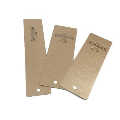 China Viable Gold Cardboard Embossed Garment Paper Hanger Tag for sale