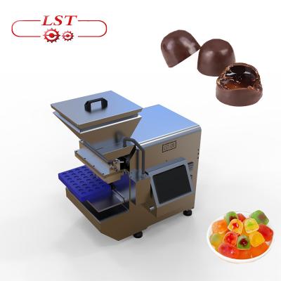 China Factory Center Frying Oil Depositor 4 Nozzles Chocolate Gummy Filling Soft Chocolate Jelly Candy Machine for sale