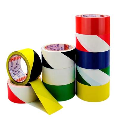 China Waterproof Colored Hazard Warning Barrier Tape Custom Self Adhesive Road Floor Marking Caution Tape for sale