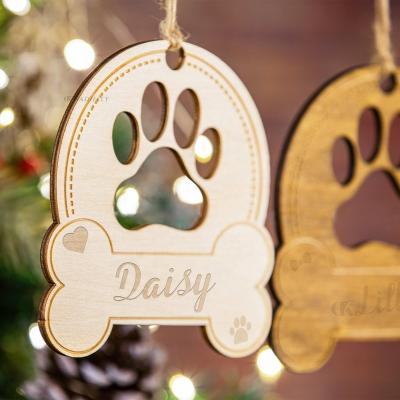 China Custom Decoration Ornaments Kit Wholesale Christmas Pendants Laser Paw Ornaments Wooden Christmas Tree Christmas Holiday Home Decor Dog Cut Ornament for sale