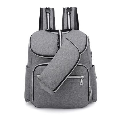 China Waterproof Urban Type Polyester Travel Mummy Baby Diaper Bag Fashion Mommy Backpack Diaper With USB Charging Port for sale