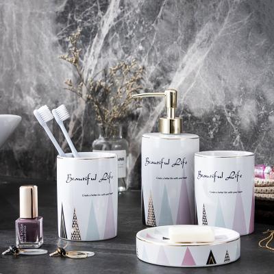 China Sustainable Color Bathroom Ceramic Toothbrush Holder Mouthwash Set Wash Cup Four Piece Set for sale