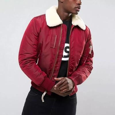 China Viable custom cut and sew men's warm shearling collar winter bomber jacket with embroidered logo for sale