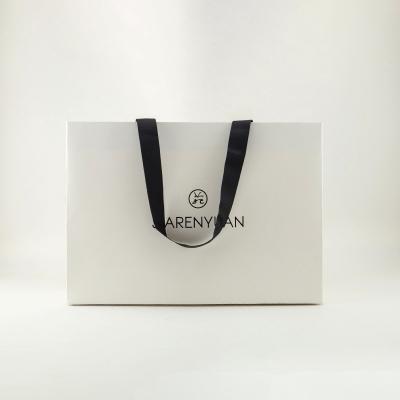 China Euro Ribbon Handle Boutique Shopping Recyclable Luxury Packaging Customized Printed Kraft Paper Gift Bags With Logo for sale