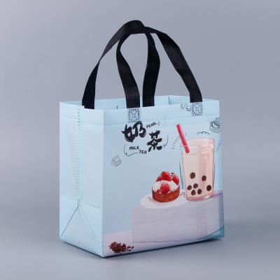 China Large Fully Handled Waterproof Leakproof Non-quilted Printed Non Woven Fabric Take-Out Bag For Food Packaging for sale