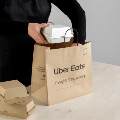 China Recycled Materials Customized 100gsm 14x10 Uber Eat Fast Food Kraft Paper Hand Labeled Brown And Black Paper Bags With Rope Handle For Shopping Grocery for sale