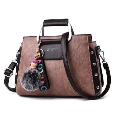 China TAS Bahu Wanita Small Casual Rivet Tote Bag Women Cute Doll Ladies Leather Shoulder Bag for sale