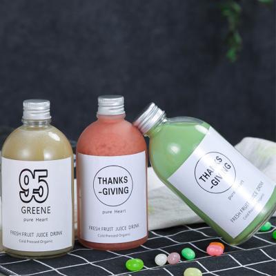 China Wholesale Glass Water Bottle 350ml 500ml Round Beverage Milk Tea Beverage Glass Bottle With Aluminum Lid for sale