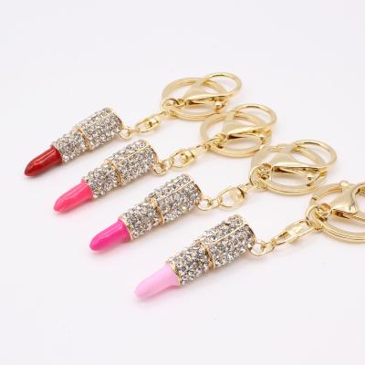 China Alloy Diamond Lipstick Key Chain Women's Bag Accessories Metal Pendant Key Chain With Different Color for sale