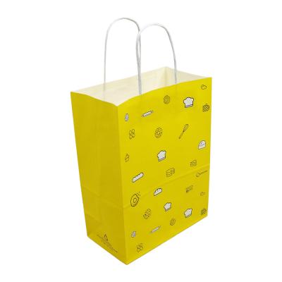 China Recycled Materials Ready To Ship Kids Portable Strong Candy Bag Paper Packaging Handle Rope Yellow Paper Bag for sale