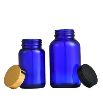 China Wholesale Blue Empty Round Bottle 60ml 100ml 120ml 150ml 16oz 10oz Capsule Medicine Vitamin Pills Glass Bottle for sale