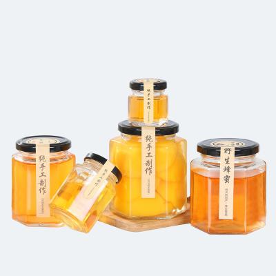 China Viable Luxury Unique Round Mini Glass Honey Jars In Bulk Empty With Lid for sale