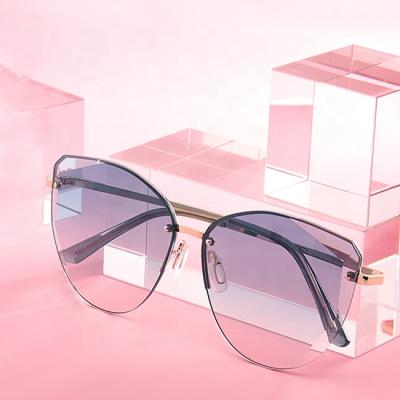 China Newest Trendy Rimless Metal Design UV400 Sunglasses Women All Match Ready Sunglasses for sale