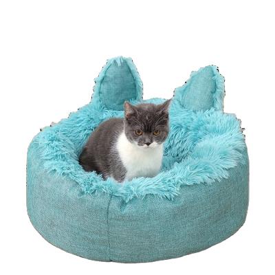 China Breathable Calming Dog and Cat Bed, Faux Fur Anti-Anxiety Design Donut Bed Small Pet Bed Fluffy Pet Cushion for sale