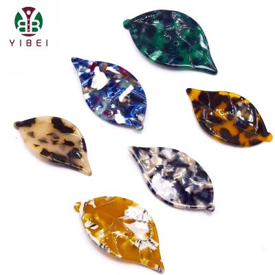 China Viable New Design 2 Holes Fashion Resin Leaf Shaped Buttons For Clothing Decoration for sale