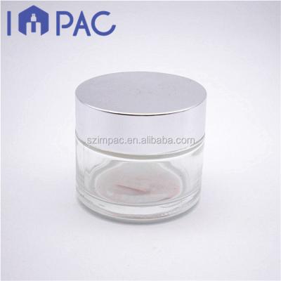 China 100ml thick glass eye cream jar with silver cap for cosmetics packaging for sale