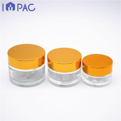 China Skin Care Cream Round Empty Cosmetic Glass Gold Cap Cosmetic Jar For Makeup Cream Powder 20ml 30ml 50ml for sale