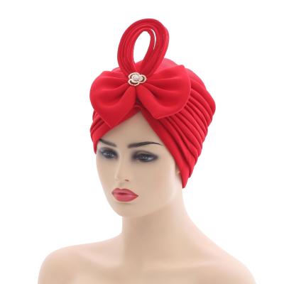 China Popular African Muslim Bowknot Folded Space Layer Cap Hat African Hat for sale