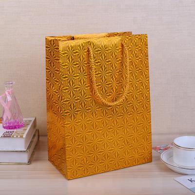 China Recyclable Luxury Holographic Metallic Gold Foil Gift Package Bag With Twisted Handle for sale