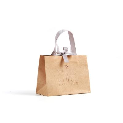 China Recyclable Custom Logo Wedding Gift Paperboard Printed Paper Bag With Ribbon Handle for sale