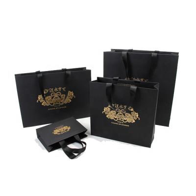 China Customized Printed Recyclable Logo Luxury Ribbon Handle Boutique Gift Shopping Paper Bags for sale