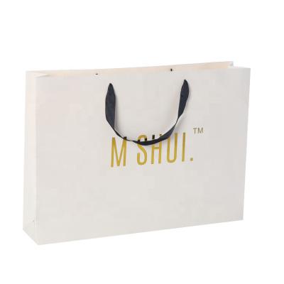 China Recyclable Luxury Custom Printed Logo Gold Stamping Gift Blank Paper Custom Shopping Bags for sale