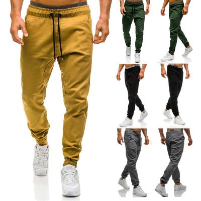 China Anti-wrinkle OEM sports pants men polyester tied elastic track pants fashion gym casual pants for men for sale