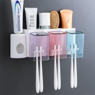 China Viable Wall Mounted Toothbrush Holder Hand Toothpaste Dispener Kids Toothbrush Holder Toothbrush Holder Cup for sale