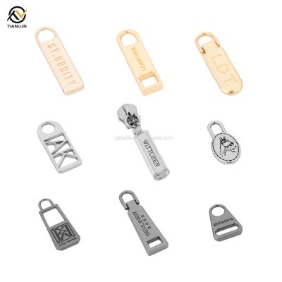 China Custom Engraved Nickel Free Logo Metal Slider Brand Zipper Gold Zipper Slider for sale