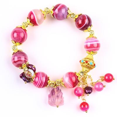 China Brazalete de piedra de ágata rosa de 14 mm con talla de zorro púrpura de nueve colas en venta