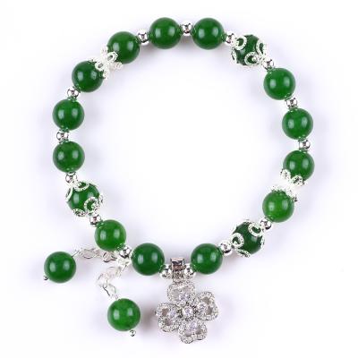 China 8MM Dunkler grüner Jade Stein mit Spinner Blumen Charme spirituelle Heilung Runde Form Stretch Perlen Armband zu verkaufen