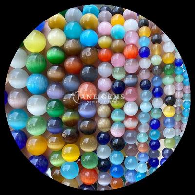 China Forma redonda Perlas de gemas coloridas Azul Verde Naranja Color de gato Ojo de perlas sueltas Filamentos para pulseras en venta