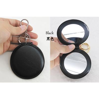 China Wholesale Cheap Promotional PVC Black Leather Mirror Pocket White Color Decoration Gift Key Chain In Stock for sale