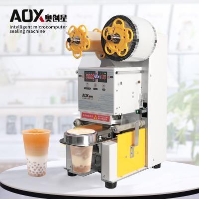 China Intelligent High Speed ​​Automatic Food Microcomputer Plastic Cup Sealing Machine Plastic Cup Sealing Machine for sale