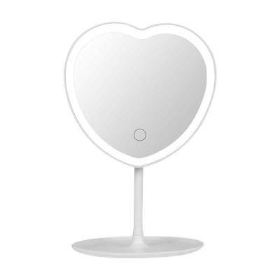 China Personalized desktop portable makeup mirror LED heart-shaped lamp makeup mirror with light beauty dressing table mirror customized for sale