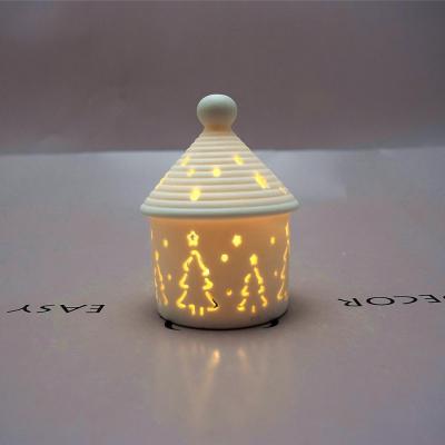 China Hollow Christmas Ceramic Round House Led Energy Saving Lamps Ornaments Bedside Lamps for sale