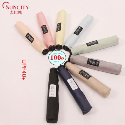 China Super Lightweight Solid Color 3 Fold Feather Carbon Frame UVA UVB Proof Air Umbrella For Sale for sale