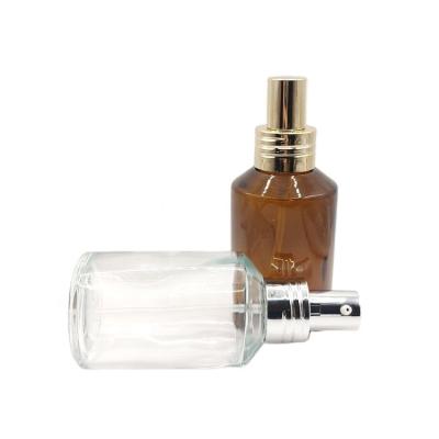 China Cosmetic Luxury 120ml clear amber Cosmetic Pump Glass Lotion Bottles Oil Pressers Bottles for sale