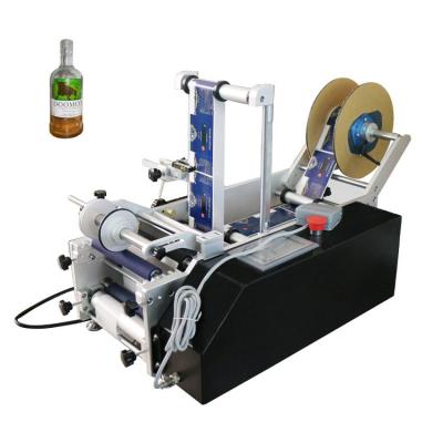 China Manual Beverage Labeling Machine For Round Bottles With Code Date Batch Printer for sale