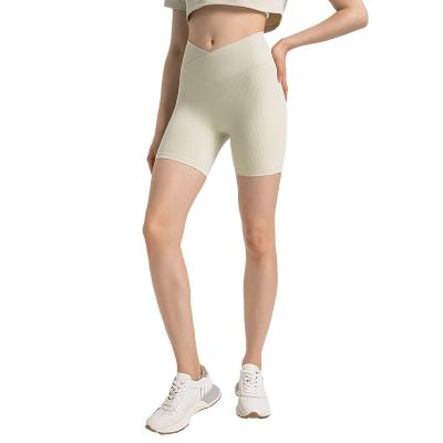 China Breathable Cross waist no-embarrassment line yoga shorts women draw threaded sports three-quarter pants for sale